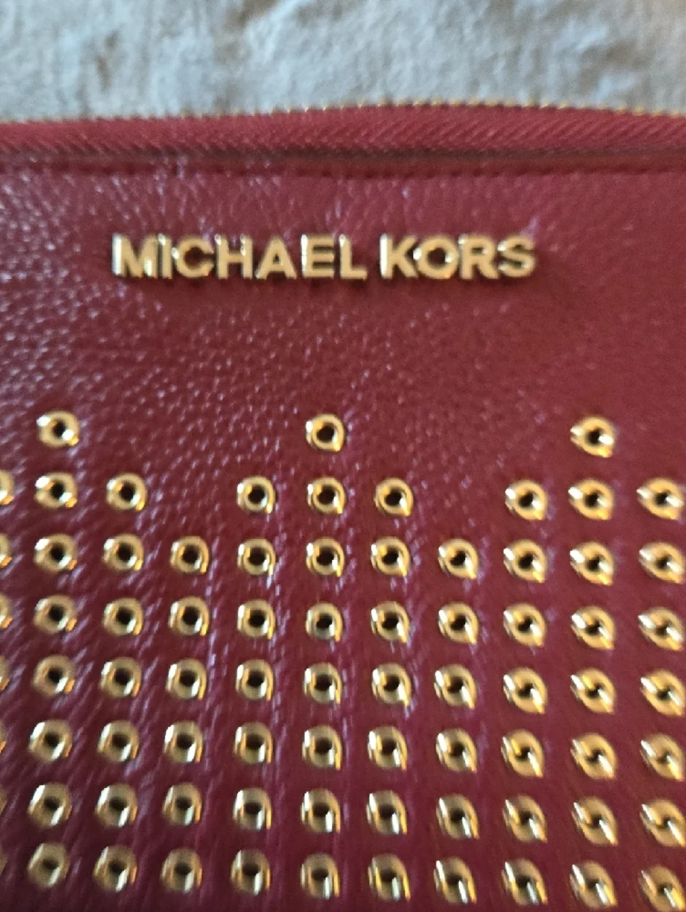 EUC Michael Kors Red Leather Zip Wallet with Gold Eyelet Accents